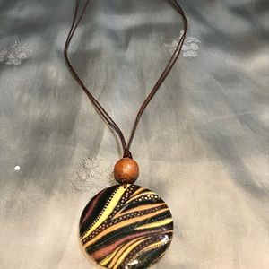 Corded brown yellow round pendant